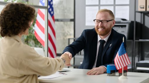 officer shaking hands with interviewee